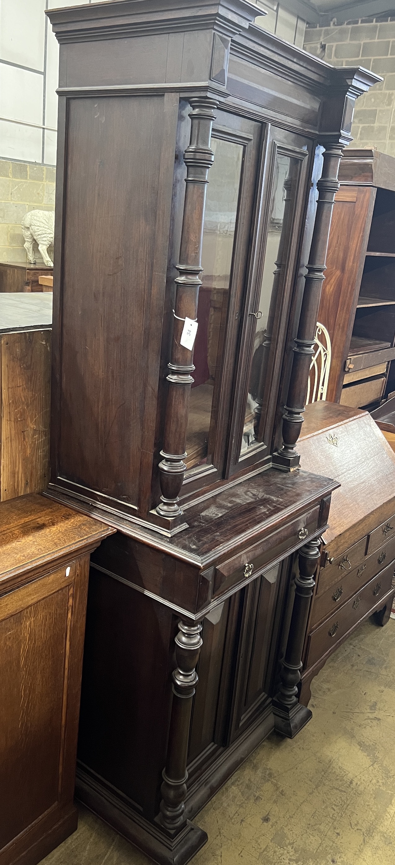 A late 19th century Flemish painted simulated rosewood narrow side cabinet, width 80cm, depth 57cm, height 221cm